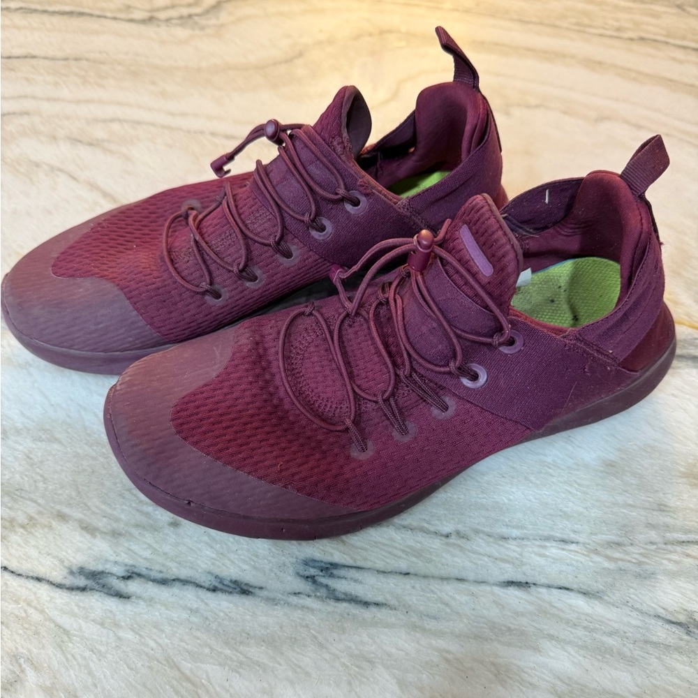 Burgundy nike running shoes